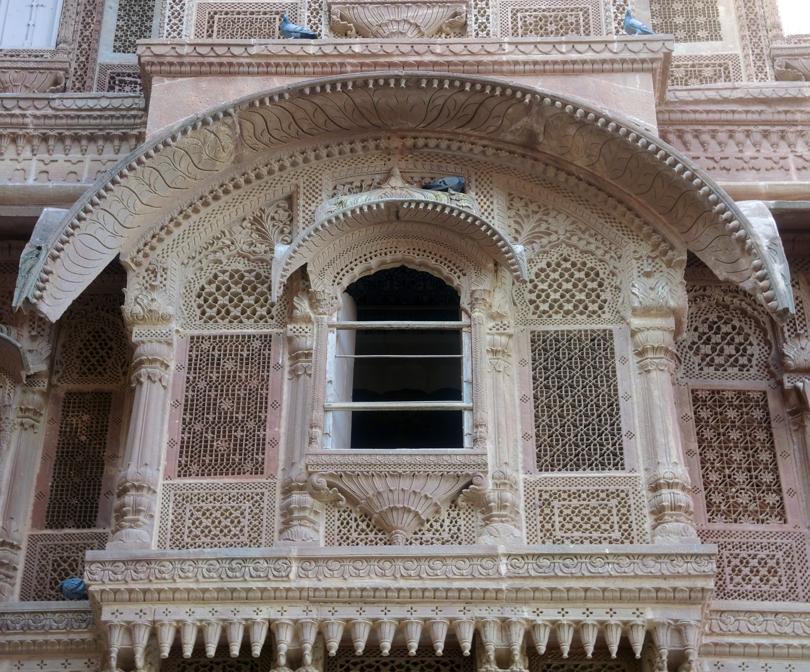 Detailed carved sandstone window screens at Mehrangarh