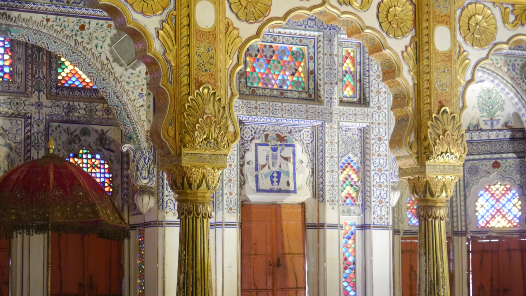 Decorated walls, ceiling and windows inside Phool Mahal at Mehrangarh